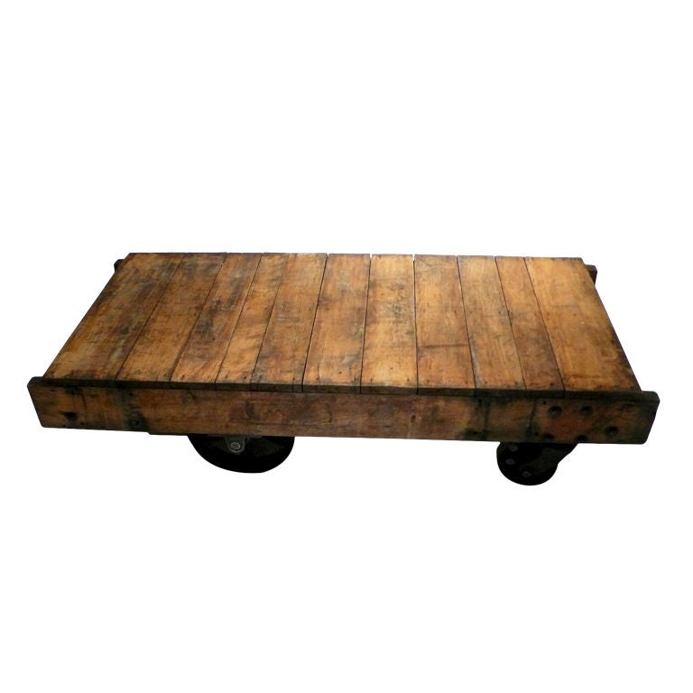 Wooden industrial cart with four metal wheels, Nutting Ind.