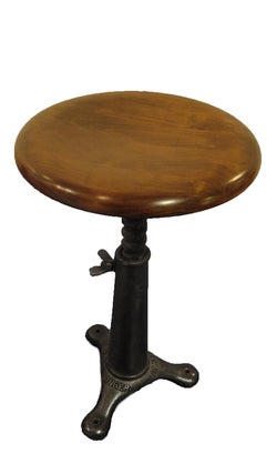 Singer industrial stool, made out of cast iron leg and wooden sit.