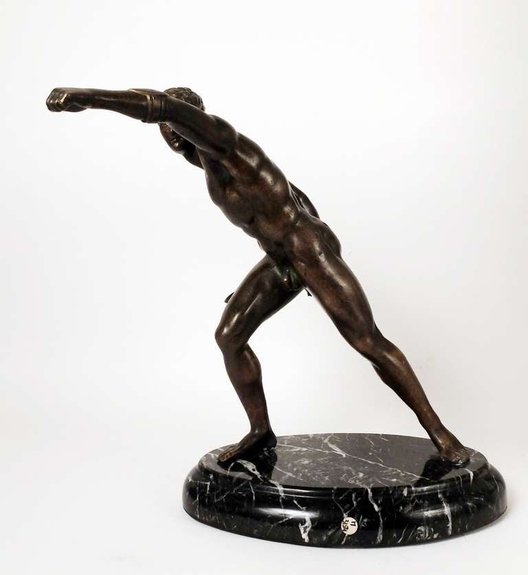 A neoclassical Italian bronze, lost wax process, depicting the Borghese Gladiator with sword over a marble base. Italy.