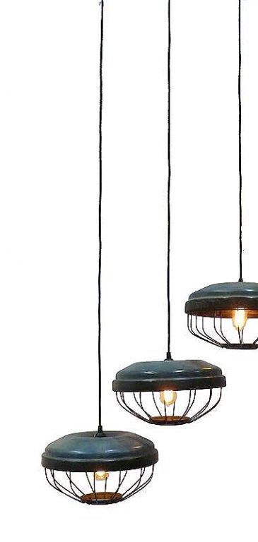 Hanghing metal enameled light, green copper color, with iron cage, to protect the bulb. Sold also separately. The price is intended for each one.