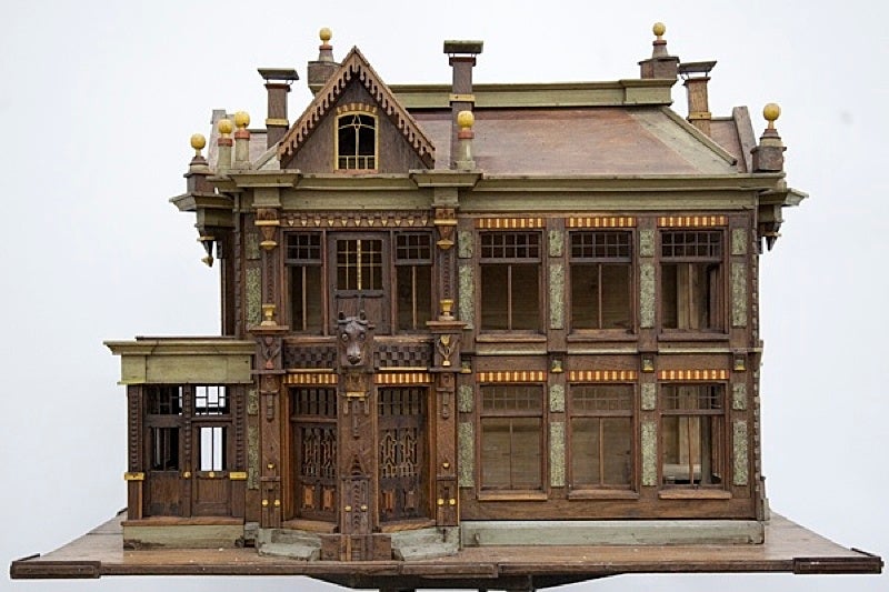 Hand made Wooden painted fretwork birds cage depicting a house , with windows, roof, and chimneies.