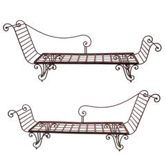 Opposing Pair of Neoclassical Iron Chaises