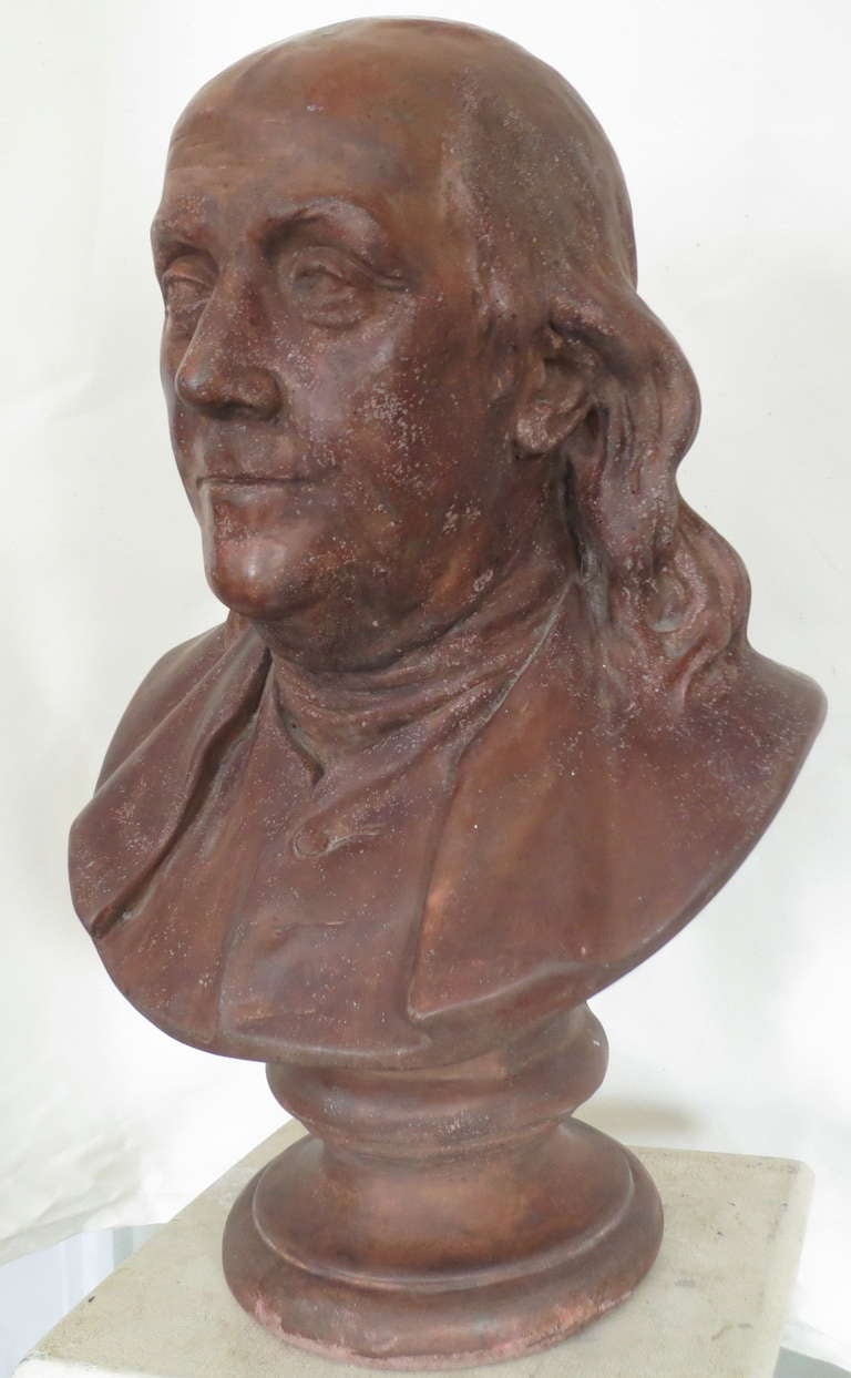 Terracotta bust of Benjamin Franklin, after Jean-Antoine Houdon. This bust seems to have been cast in two pieces with a vertical seam line visible. The casting is filled and weighted. Houdon and 1778 are inscribed on the back, but we are unsure of