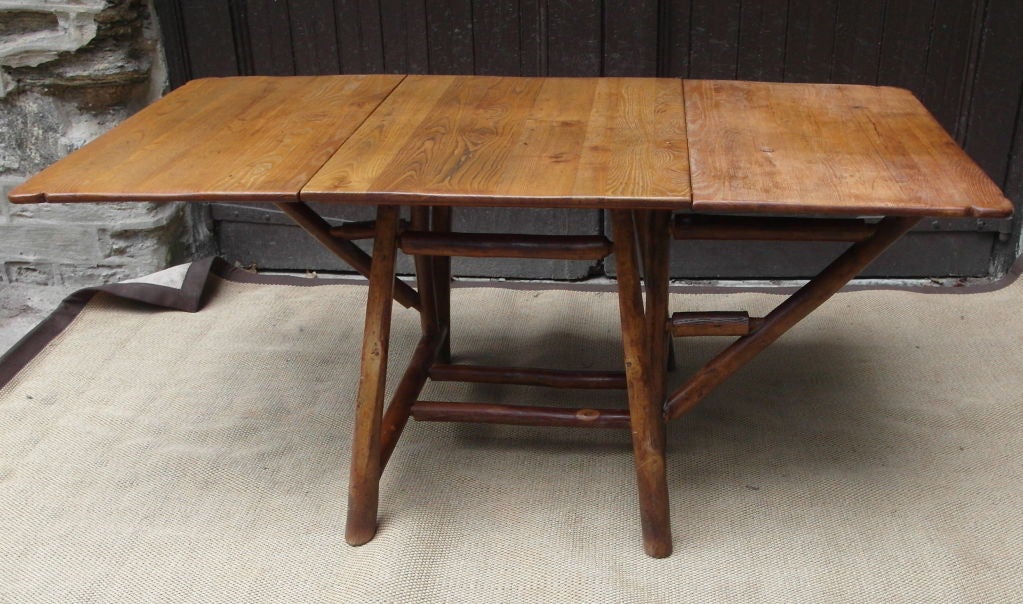 Exceedingly well constructed Old Hickory dining table in original finish, with shaped top, generous proportions<br />
Stamped Old Hickory, Martinsville Indiana