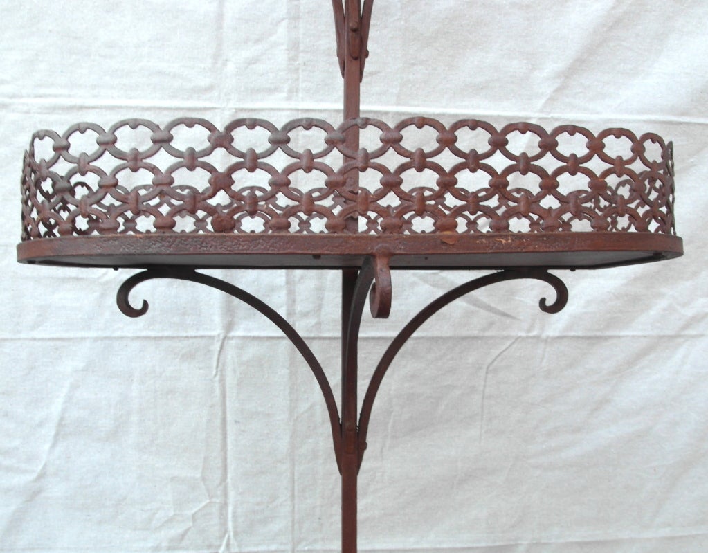 Hand wrought iron 3 tier plant stand, old red paint with nice wear and texture, great design and wonderful construction