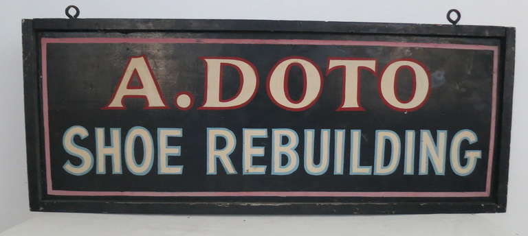 Great colors and graphics on this circa 1920's shoe repair sign