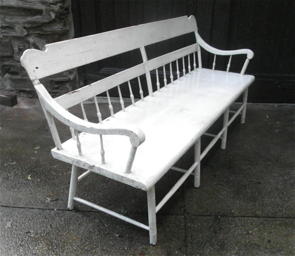 Windsor style deacon's bench with a comfortable wide single plank seat, sturdy and handsome, this bench is in a white paint from the early 20th century, attractively crackled with some flaking to the paint.