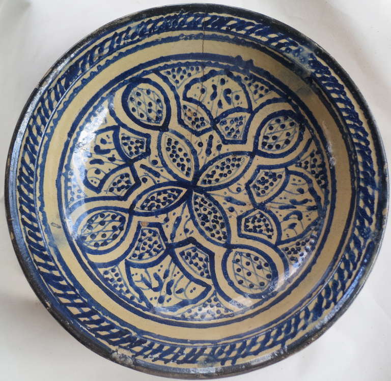 Large blue and white bowl with traditional decoration.  Wonderful strong graphic with hole for wall mounting.