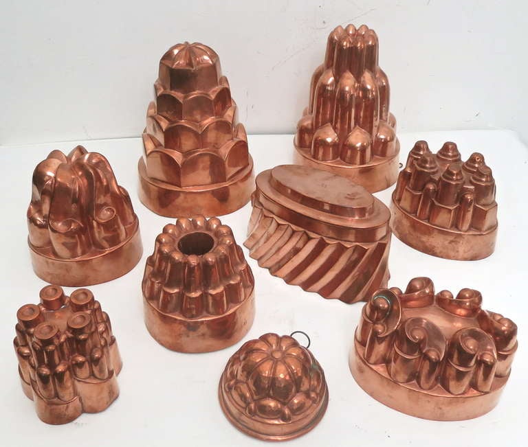 A collection of 9 Victorian jelly molds in various sizes, 2 are quite large 8.5 in. tall, one appears slightly later than the others probably about 1890