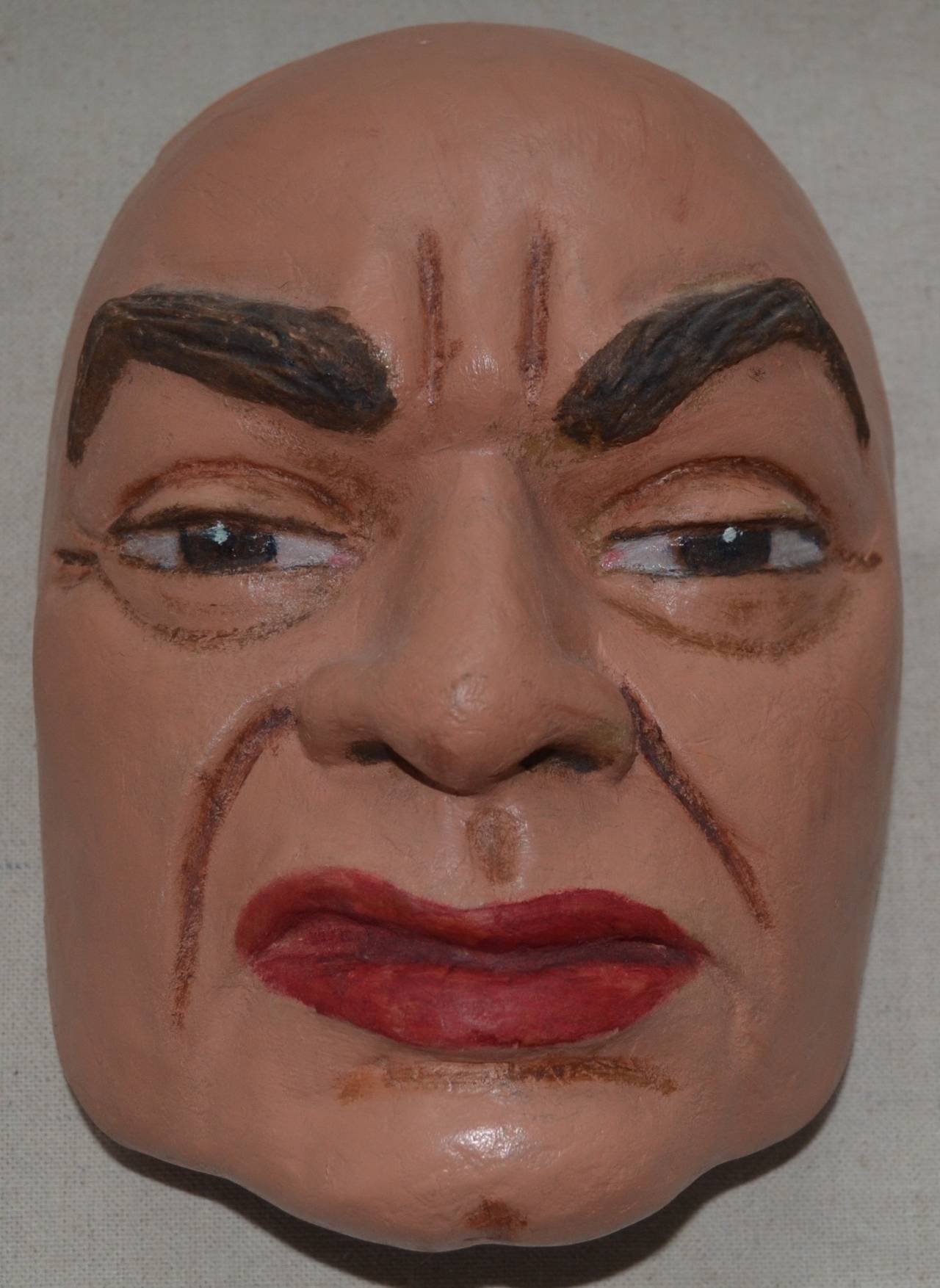 Papier mâché portrait mask of the gangster portraying actor Edward G. Robinson, by Violet Clark, (1903-1999), signed and dated on interior. Known as the "Woman of a Thousand Faces", Clark, of Stroudsburg, PA, created lifelike portrait