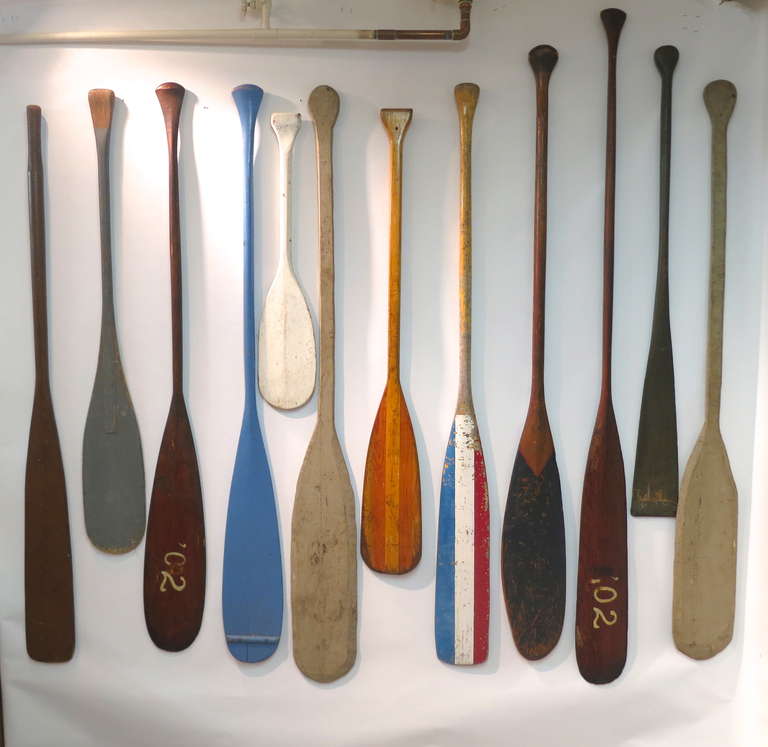 Collection of antique wooden oars of wonderful form.  Some are painted, two are in pairs of longer and shorter,  and one pair from Provincetown has the date of 1902.  A good collection with lots of visual impact.  Dimensions are given for the