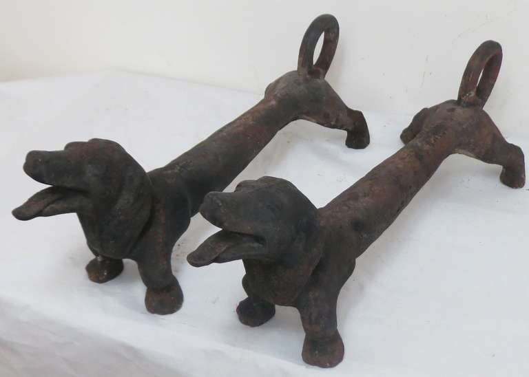 Circa 1920's dachshund firedogs, great design with curved tail for holding logs, exhuberant expressions