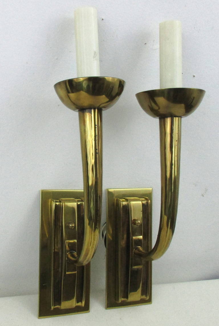 Well-made heavy brass sconces, beautiful lines and mounts. Rewired and ready for installation.