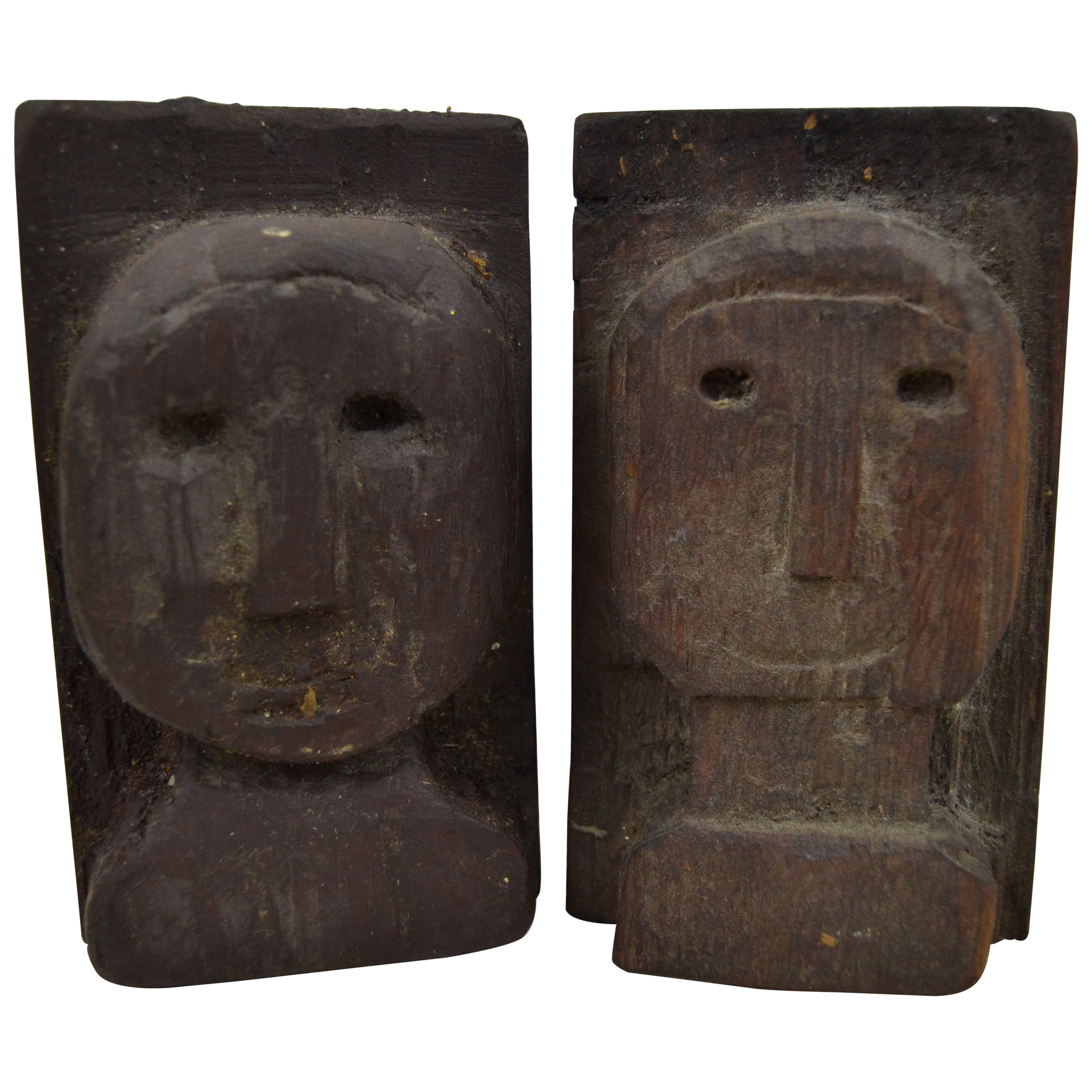 Pair of Folky Relief Carved Heads For Sale