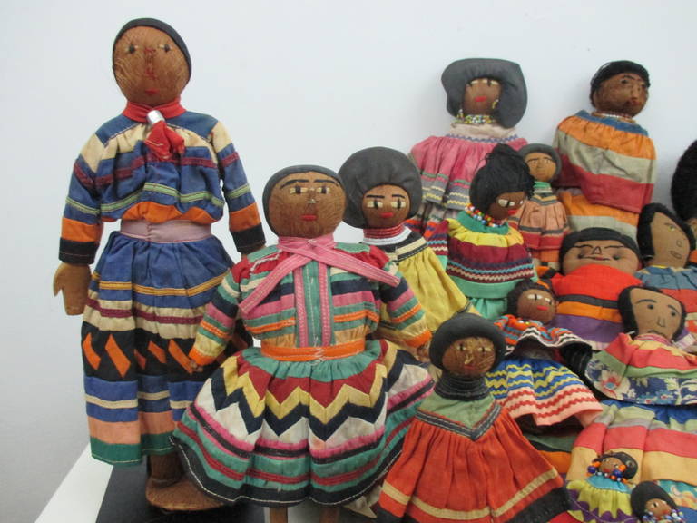A collection of 25 Seminole dolls dating from the 1920s through the 1960s.
There are two male dolls with applique clothing (11