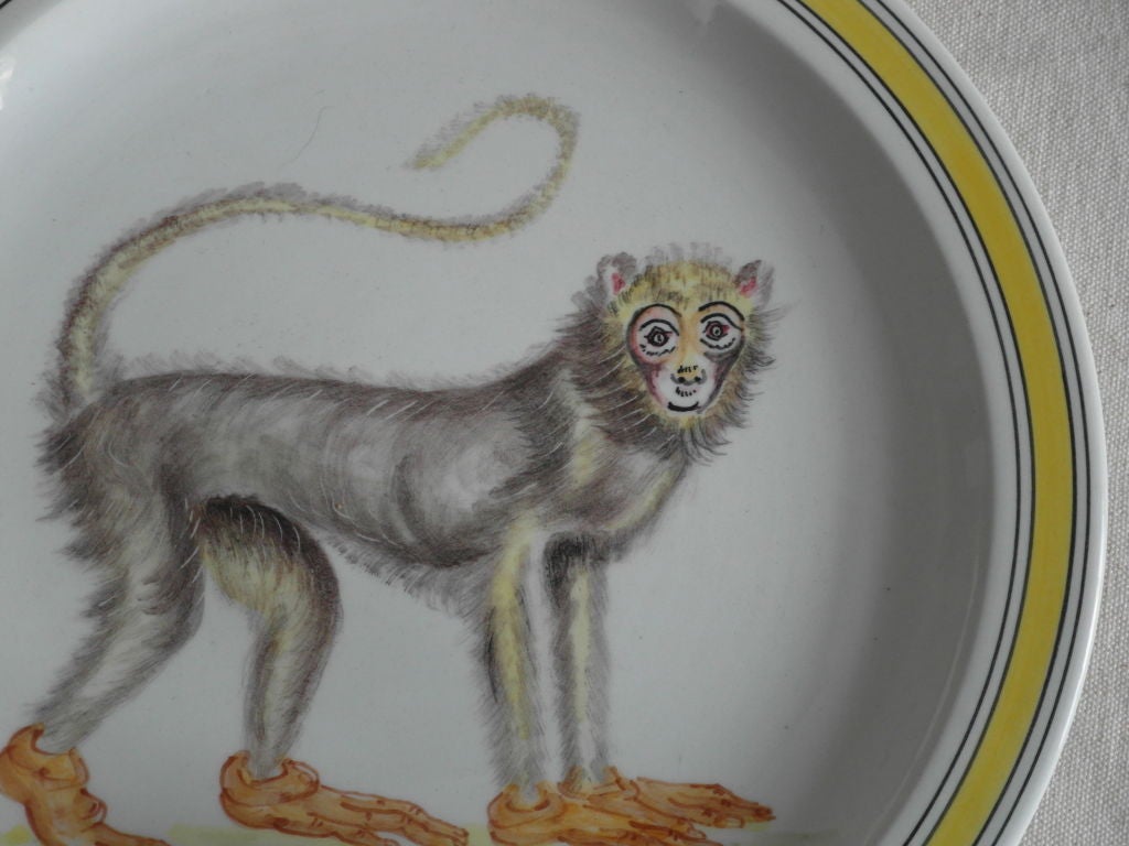 6 handpainted Italian monkey plates. 3 with yellow border and 3 with green border