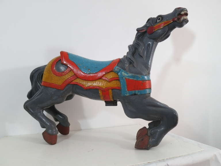 Carved wood carousel horse with park paint, nice small child's size.Hollow body with solid carved head, legs, and tail.  Bright and lively paint with strong carving.