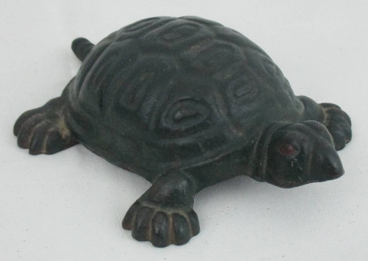 Whimsical turtle doorstop in rare original paint. Stamped 