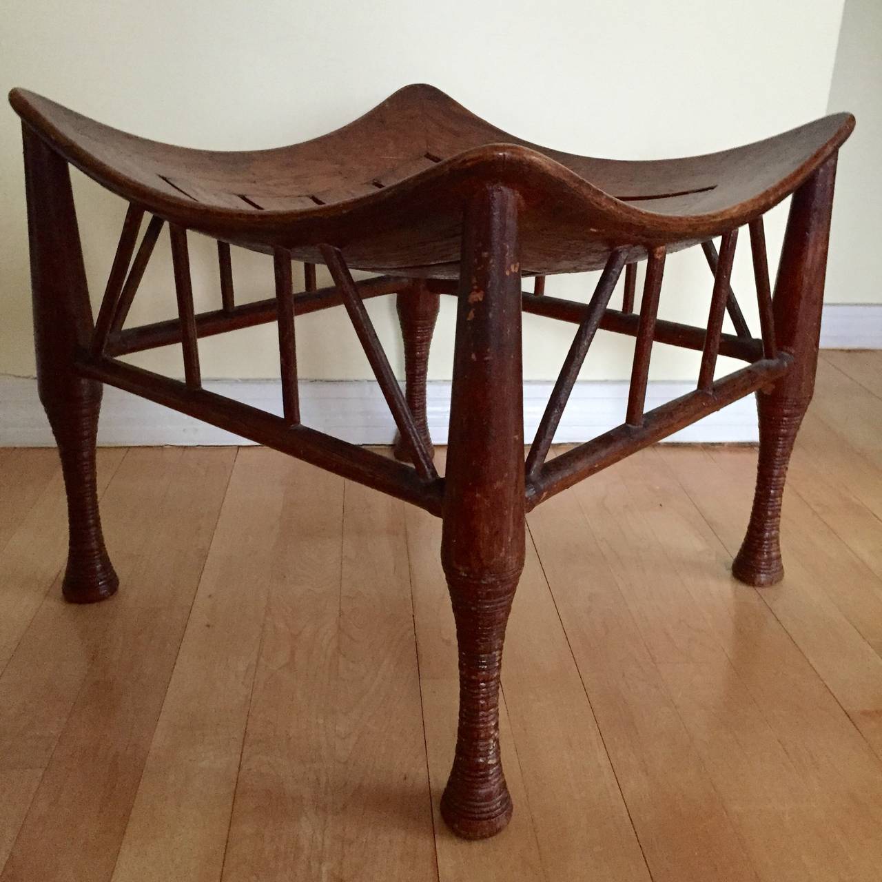 Oak Thebes stool with curvaceous bentwood seat attributed to Liberty of London.  Old likely original finish.