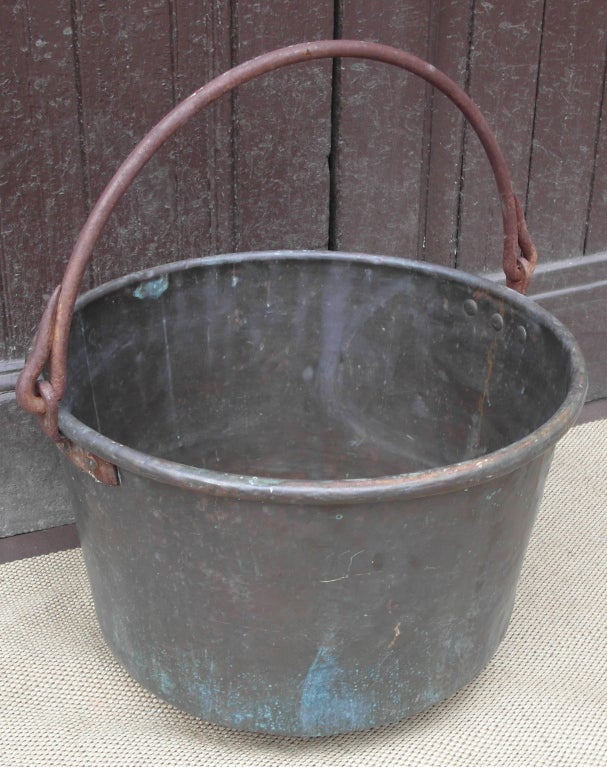 Copper apple butter kettle with forged iron handle. original unpolished condition, nice color and good scale