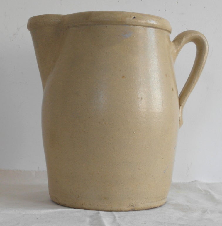 A four gallon, wheel thrown American pottery pitcher with applied handle and spout. Huge and truly impressive this 19th century pitcher is in wonderful condition