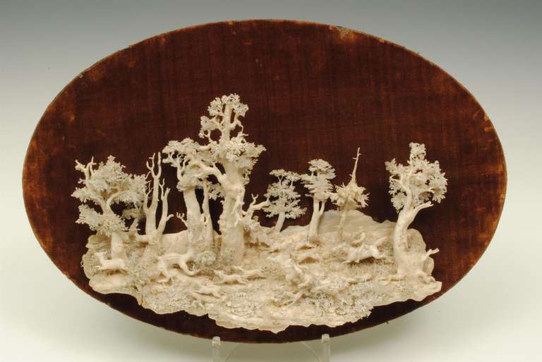 A remarkable carved ivory picture of a hunting scene in 3 dimension. It is believed it took 3 years work to created the work.