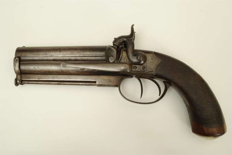 A good example of a 19th century over and under percussion pistol with the original belt clip. Reilly, New Oxford Street, London