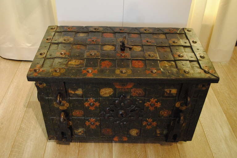A fine example of German strong box or Armada chest with the original painted decoration including flowers and landscapes. The original key opens it to show a well engraved lock plate.
