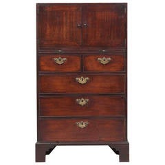 A Rare Irish Mahogany Chest with cupboard on top.