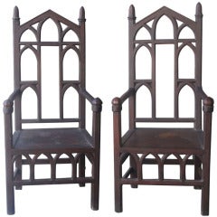 A Pair of Gothic Revival Oak Arm Chairs
