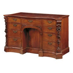 Antique A George III carved mahogany kneehole desk