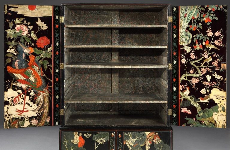 Two George lll coramandel lacquer cabinets, incorporating 17th century panels.

The panels depicting a palace setting, musicians on horseback, courtiers, guards, a statue of a Dog of Fo, ladies on balcony, dragons, peacocks, herons, ducks, a