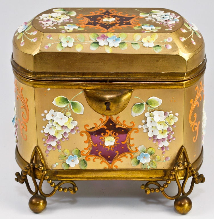 Unique antique sugar casket by Moser (unsigned), raised on heavy brass base with ball feet and garland of balls to accent the high gold finish.  The balance of the hinged lip/opening framework has the same fine old patina, and while missing a