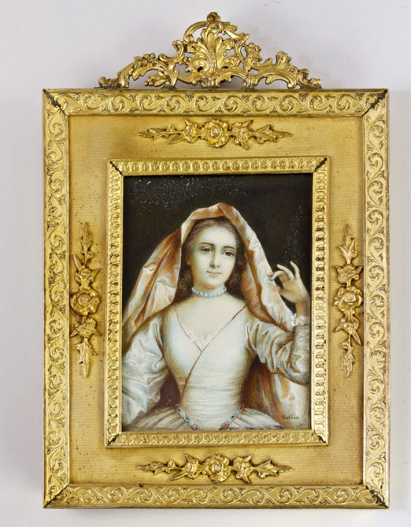 A magnificent antique French dore bronze frame houses this stunning old portrait which is of a member of the Boucher D'Orsay family of French nobility, though we are unsure of just which of the family members she is.  A beauty, she's pictured here