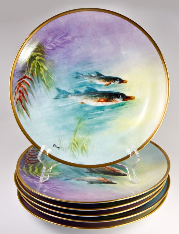 A fine set of 6 hand painted cabinet or fish service plates, 9.5