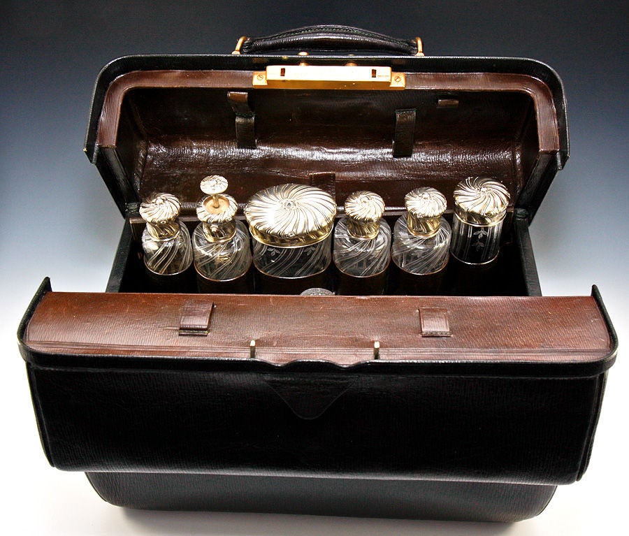 Exceptionally fine large Trousse de voyage (travel case and vanity), mid-1800s, complete with all jars, sterling lids, to include a larger than usual liqueur flask with fitted cup, pump-spray perfume flask, many jars and bottle, and a fitted travel