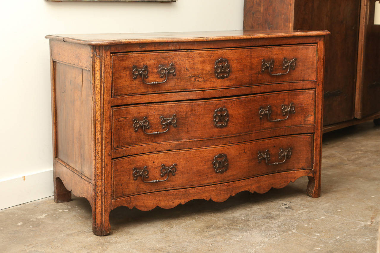 18th century walnut three-drawer commode from Ceveres in Provence. Original pewter hardware, beautiful patina and carving.