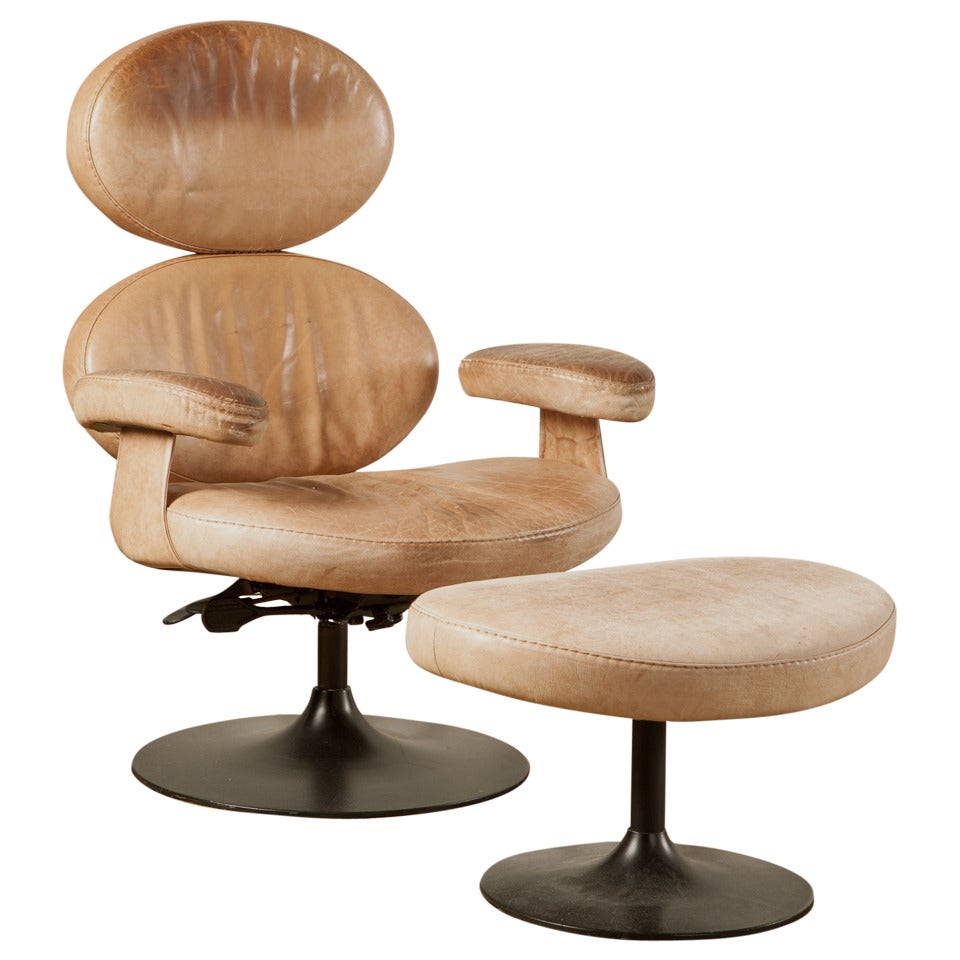 An Unusual Circular Leather Armchair With Matching Stool For Sale