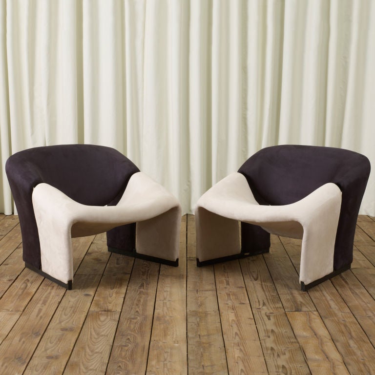 A 1970's beautifully restored pair of lounge chairs by Pierre Paulin.  Metal structure. Newly reupholstered in black and ivory faux suede fabric.  Pierre Paulin, one of the most important French designers of the 20th century, famous for his sensuous