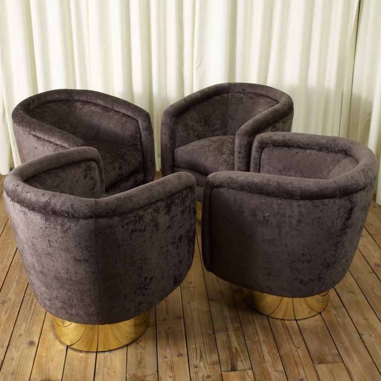 A pair of beautiful swivel tub chairs. These are a similar style to Milo Baughman designs but distinctly Italian and very chic
Wonderful shape. 
Newly reupholstered in stunning dark grey velvet.
Available as pairs.
