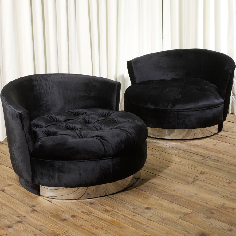 Pair of oversized round chaises reupholstered in a beautiful black velvet on chrome and velvet bases. Real focus pieces in any interior.