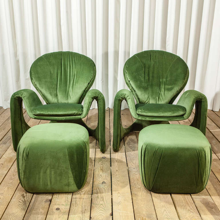 A pair of green velvet spider chairs with matching footstool.  Newly upholstered.