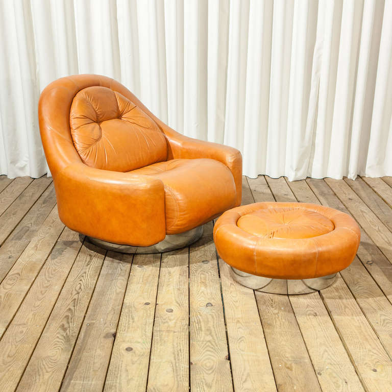 A Mariani for Pace Leather oversized armchair and footstool.  Original leather.