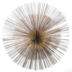 An Oversized Starburst Wall Sculpture by Curtis Jere