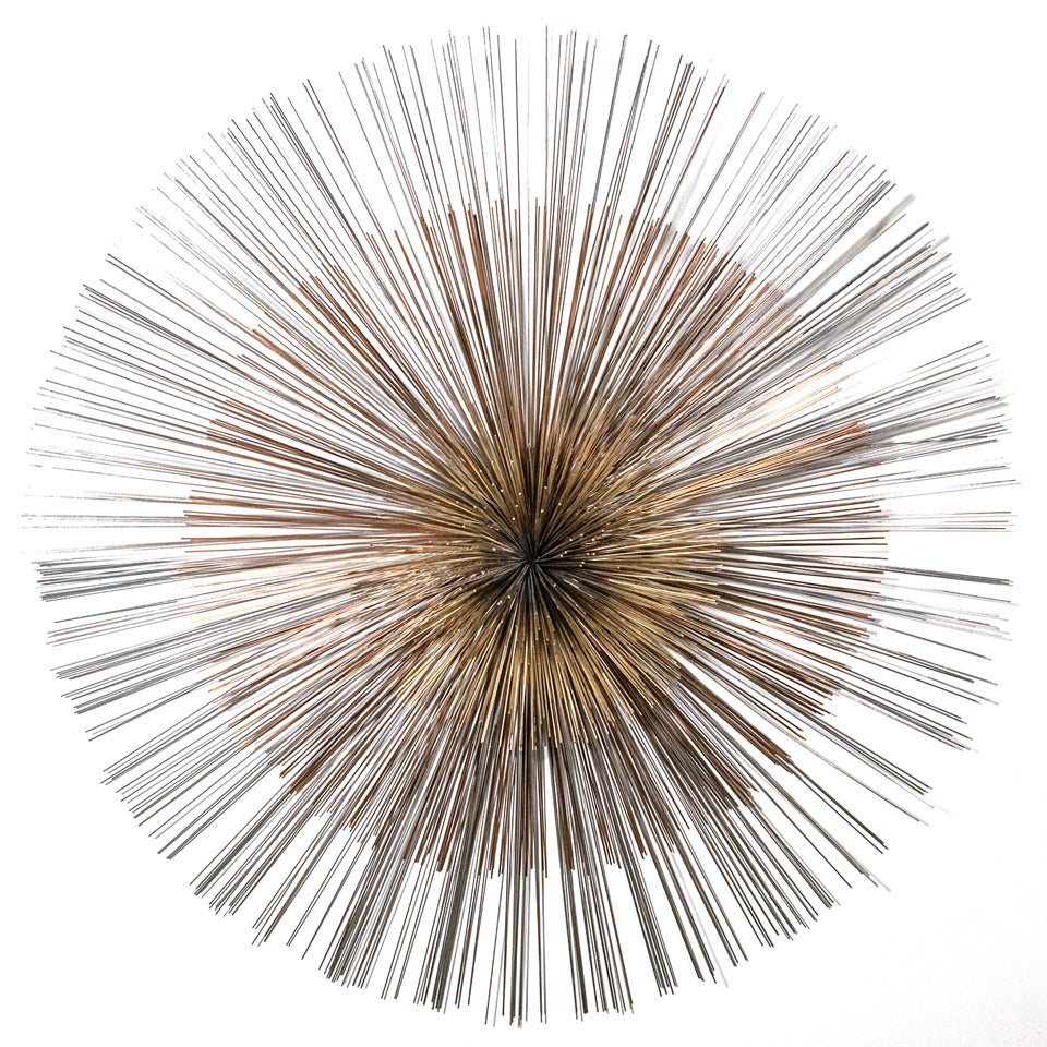 An Oversized Starburst Wall Sculpture by Curtis Jere