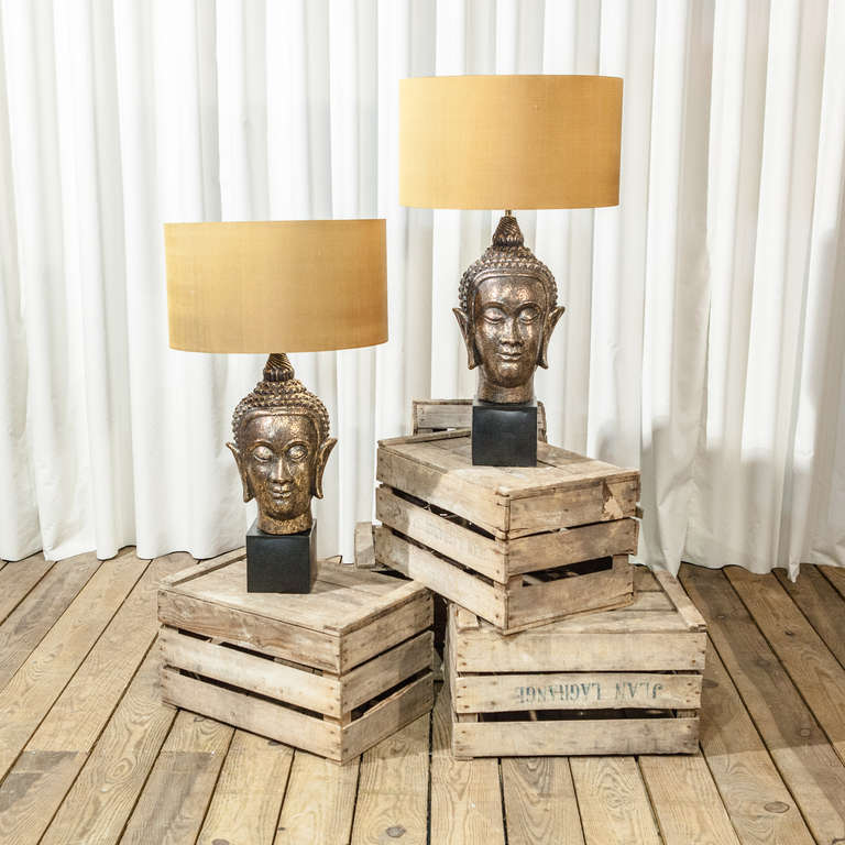 A Pair of Bronzed Buddha Lamps