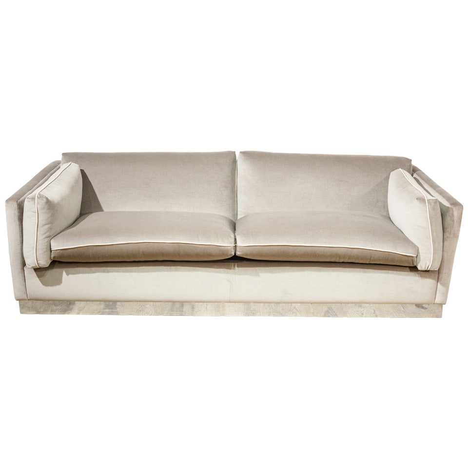 Stunning Upholstered Three Seater Sofa with Chrome Plinth For Sale