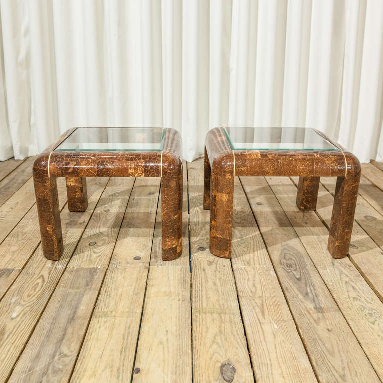 A Pair of Maitland Smith Coconut with Brass inlay and Glass top.