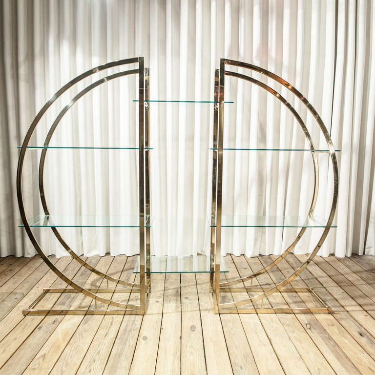 A Pair of D Shaped Etageres in Brass with Glass Shelves