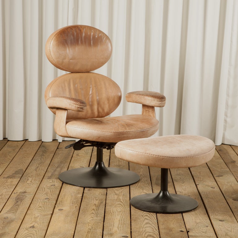 An Unusual Circular Leather Armchair With Matching Stool For Sale at